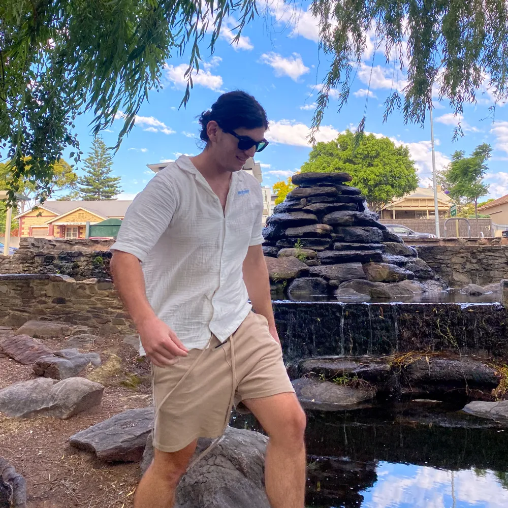 Kaya by a rock waterfall pond in a park